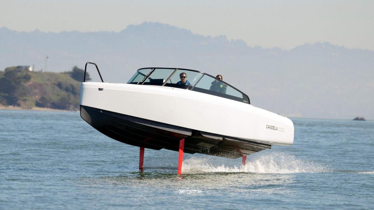 French sailor Tanguy de Lamotte, CEO of Candela US, drives the company's 'flying' electric C8 boat in Sausalito, California on February 8, 2023. — AFP