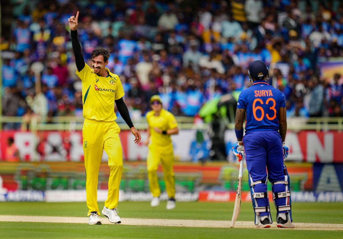 Australian pace bowler Mitchell Starc celebrates the wicket of Indian batter Suryakumar Yadav during the second ODI match. — PTI