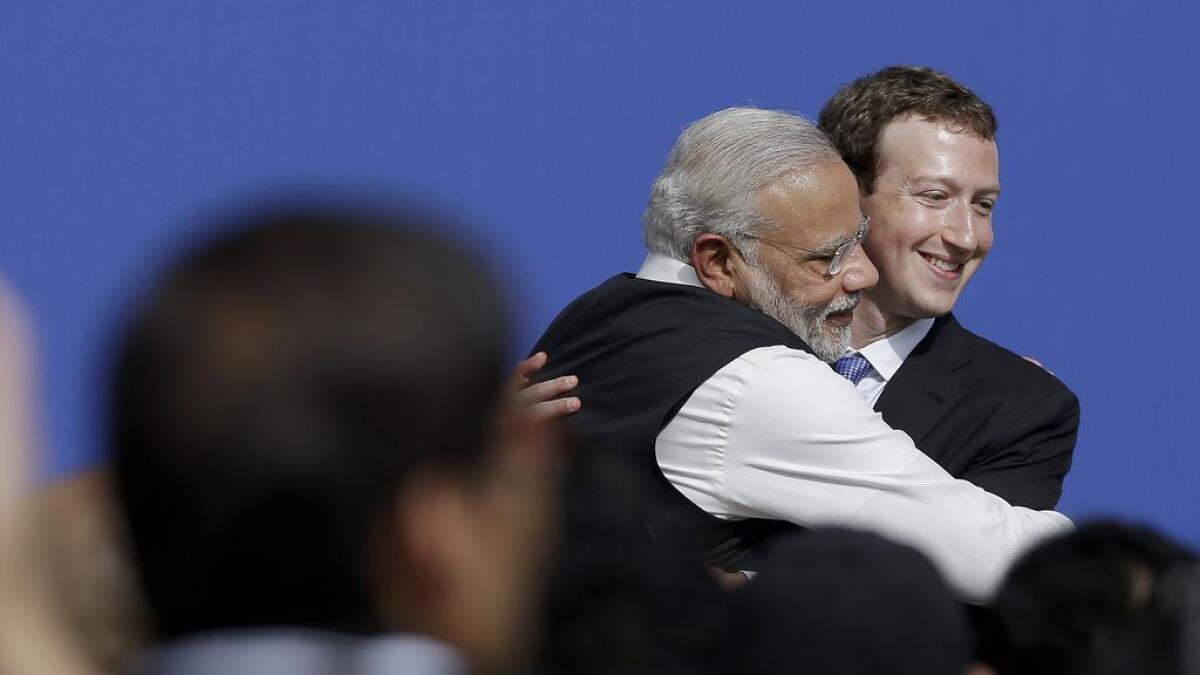 Facebook CEO Mark Zuckerberg, right, hugs Prime Minister of India Narendra Modi at Facebook in Menlo Park, on Sept. 27, 2015. 