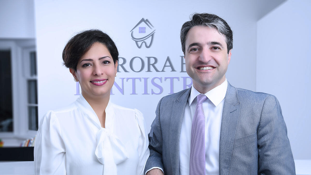 A victim of the Ukraine International Airlines crash in Iran, Dr. Parisa Eghbalian (L) poses with her husband Dr. Hamed Esmaeilion at their dentistry practice in Aurora, Ontario, Canada in an undated photo. Dr. Eghbalian died in the crash along with her daughter Reera Esmaeilion, 9. Her husband Dr. Esmaeilion is now enroute to Tehran.