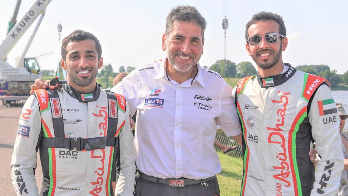 Mansoor Al Mansoori (right), Rashed Al Qemzi and Team Abu Dhabi manager Guido Cappellini (centre). — Supplied photo