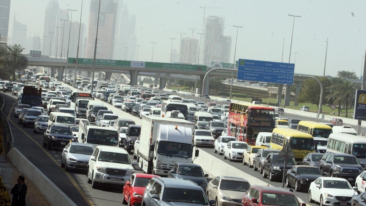 Slow moving traffic on Sheikh Zayed Road near FAB metro station due to multiple accidents in Dubai.