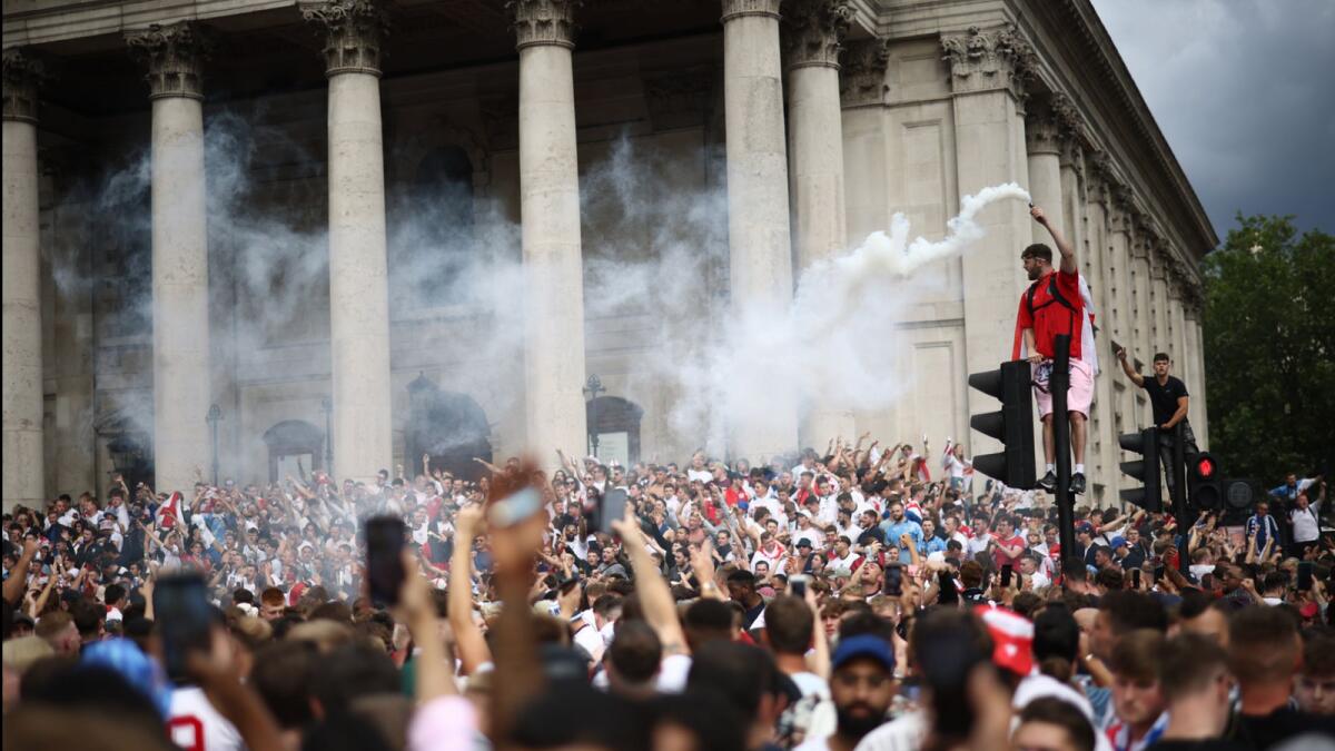 England fans with flares gather in Trafalgar Square ahead of the match. Reuters