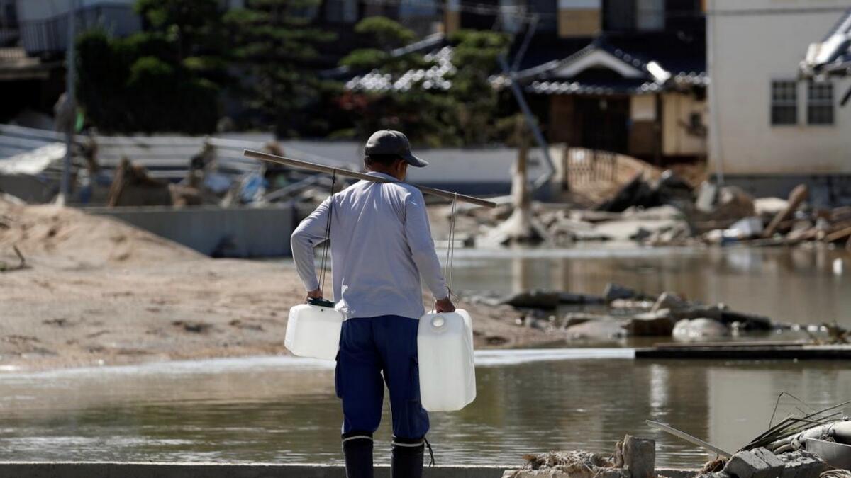 Japan flood toll nears 200, sun scorches thousands battling thirst 