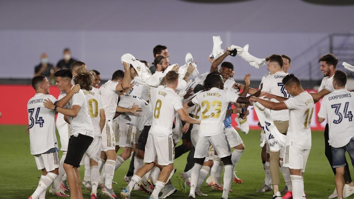 Real Madrid players celebrate after winning the Spanish La Liga 2019-2020