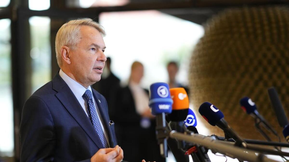 Finland's Foreign Minister Pekka Haavisto speaks with the media as he arrives for a meeting of EU foreign ministers at the Prague Congress Center in Prague, Czech Republic.