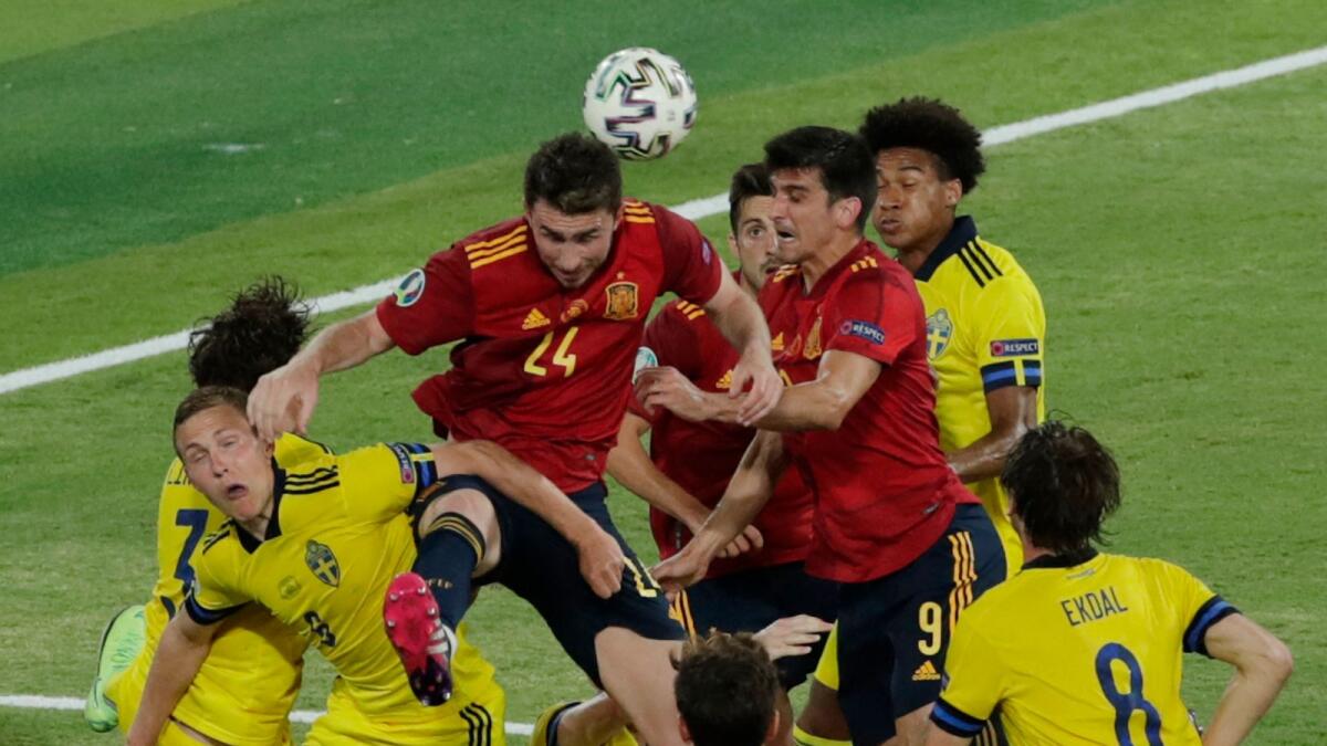 Players vie for the header during the Euro 2020 Group E match between Spain and Sweden. (AFP)