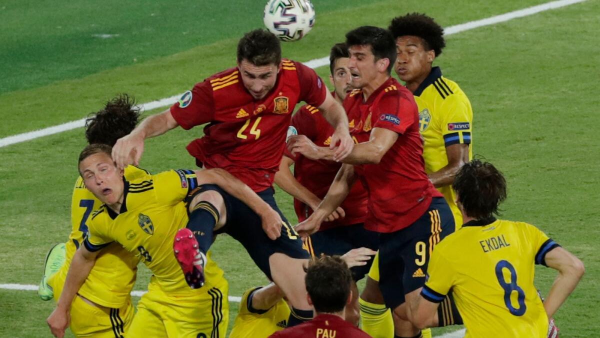 Players vie for the header during the Euro 2020 Group E match between Spain and Sweden. (AFP)