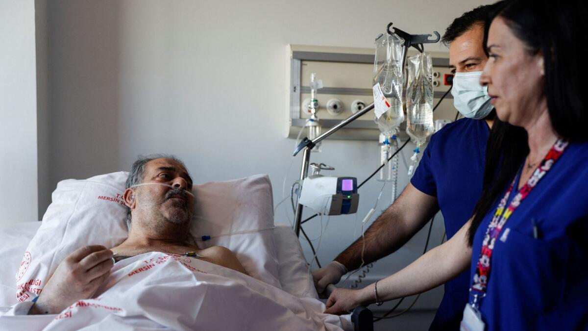 Huseyin Berber speaks to media and doctors as he receives medical attention at Mersin City hospital in Turkey. — Reuters