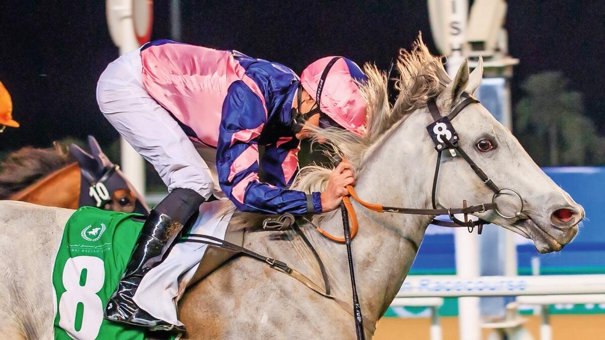 Dream run: Lord Glitters, ridden by Daniel Tudhope, races to victory in the Singspiel Stakes during the Dubai World Cup Carnival meeting at Meydan Racecourse on Friday. — Dubai Racing Club