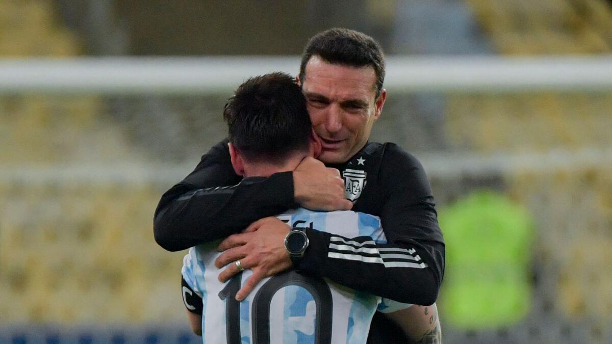 Argentina's Lionel Messi (left) and coach Lionel Scaloni embrace after winning the Conmebol 2021 Copa America tournament final. — AFP