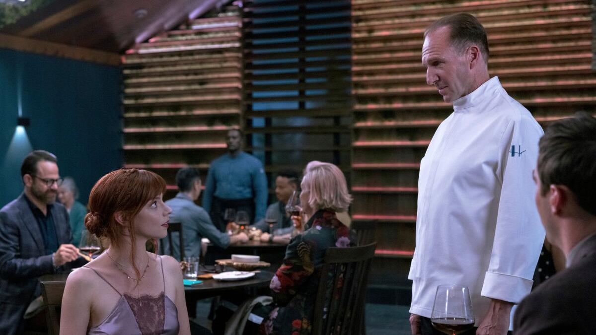 Ralph Fiennes and Anya Taylor-Joy in a scene from the film 'The Menu'