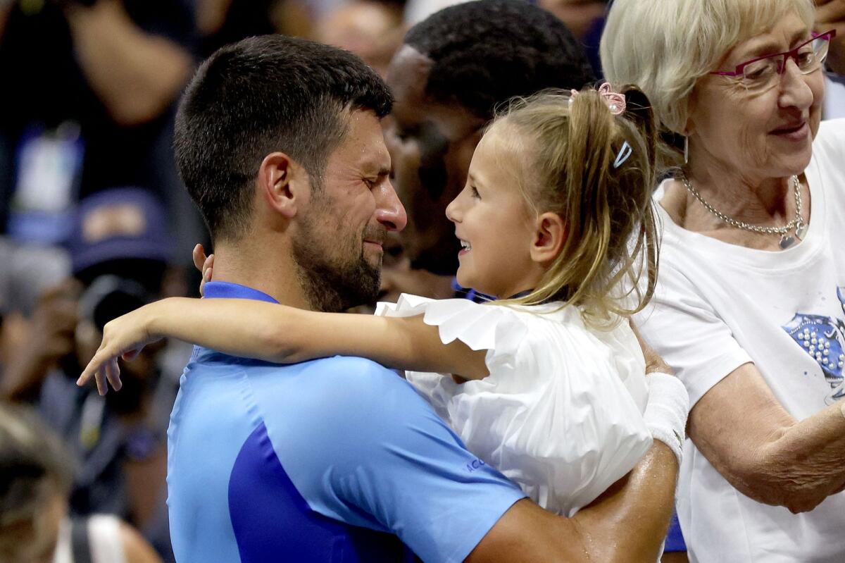Novak Djokovic of Serbia celebrates with daughter Tara after defeating Daniil Medvedev of Russia in the US Open final. — AFP