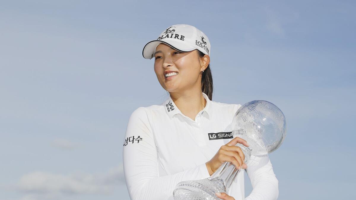 Ko Jin-young of Korea with the CME Globe trophy after winning the CME Group Tour Championship. — AFP