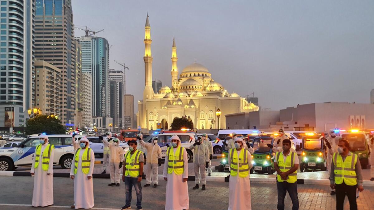 Officials and workers of Sharjah Municipality, Beea'h, Sharjah Police and Sharjah civil defence during the National Disinfection Program closing parade at Sharjah's Buhaira Corniche. Photo: M. Sajjad/Khaleej Times