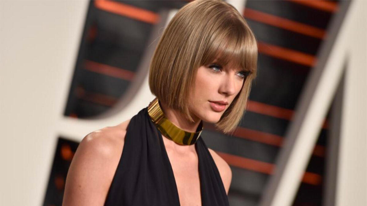 Taylor Swift wins groping trial against DJ, awarded symbolic $1 