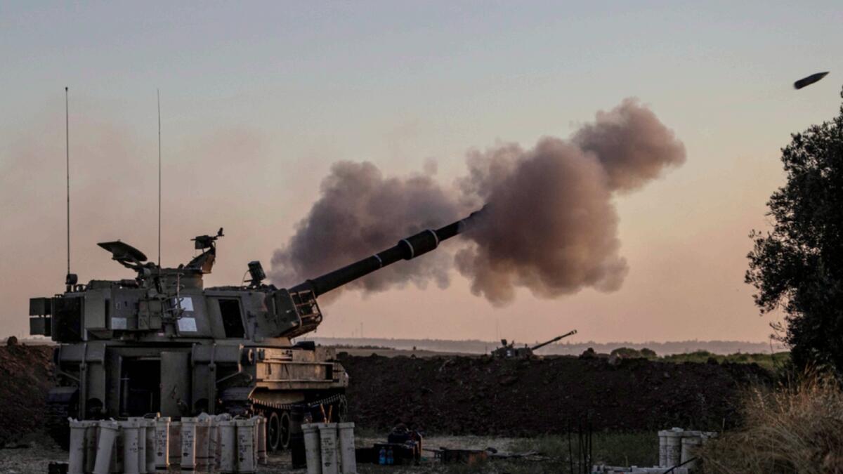 An Israeli artillery unit fires toward targets in Gaza Strip on Tuesday. — AP