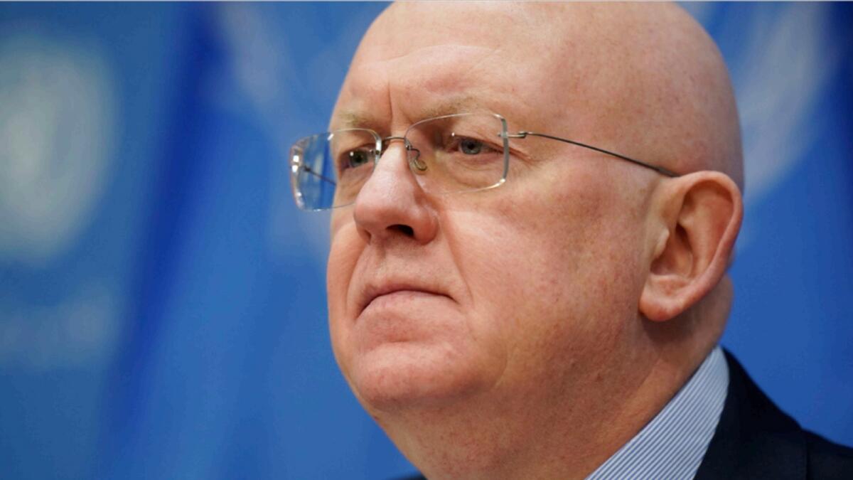 Russian Ambassador to the United Nations Vasily Nebenzya listens to reporters at United Nations headquarters. — AP