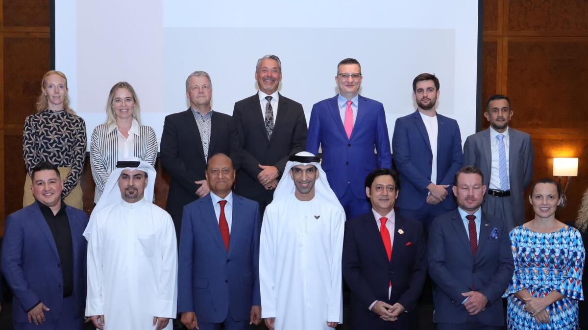 Dr Thani Al Zeyoudi, UAE Minister of State for Foreign Trade; Fahad Al Gergawi, CEO of Dubai FDI; and Javed Malik, president of the Diplomat Business Club, with delegates at the launch of the UAE Business Opportunities Forum