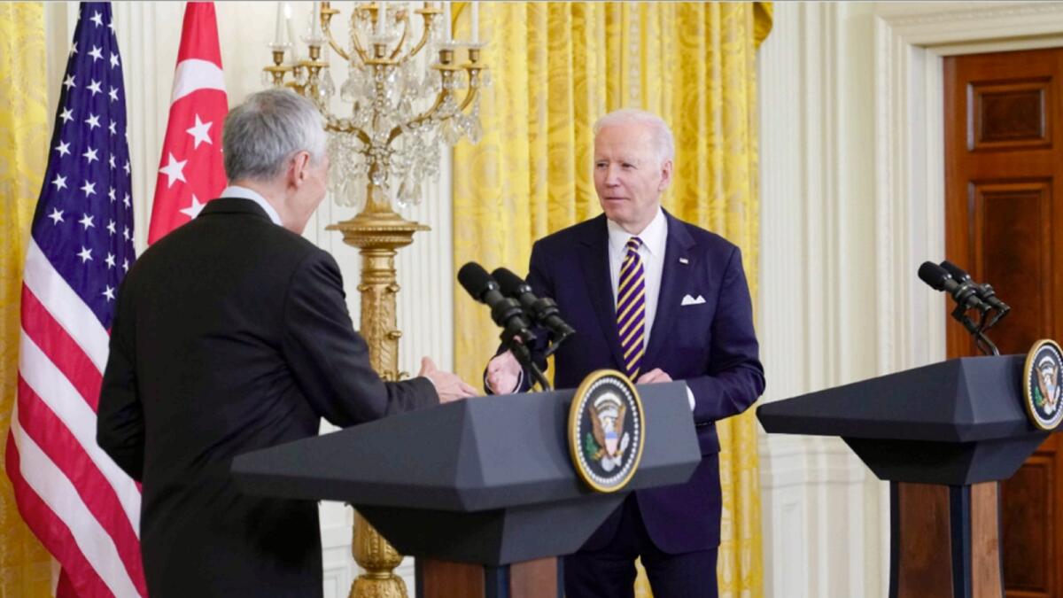 President Joe Biden shakes hands with Singapore's Prime Minister Lee Hsien Loong in the East Room of the White House. — AP