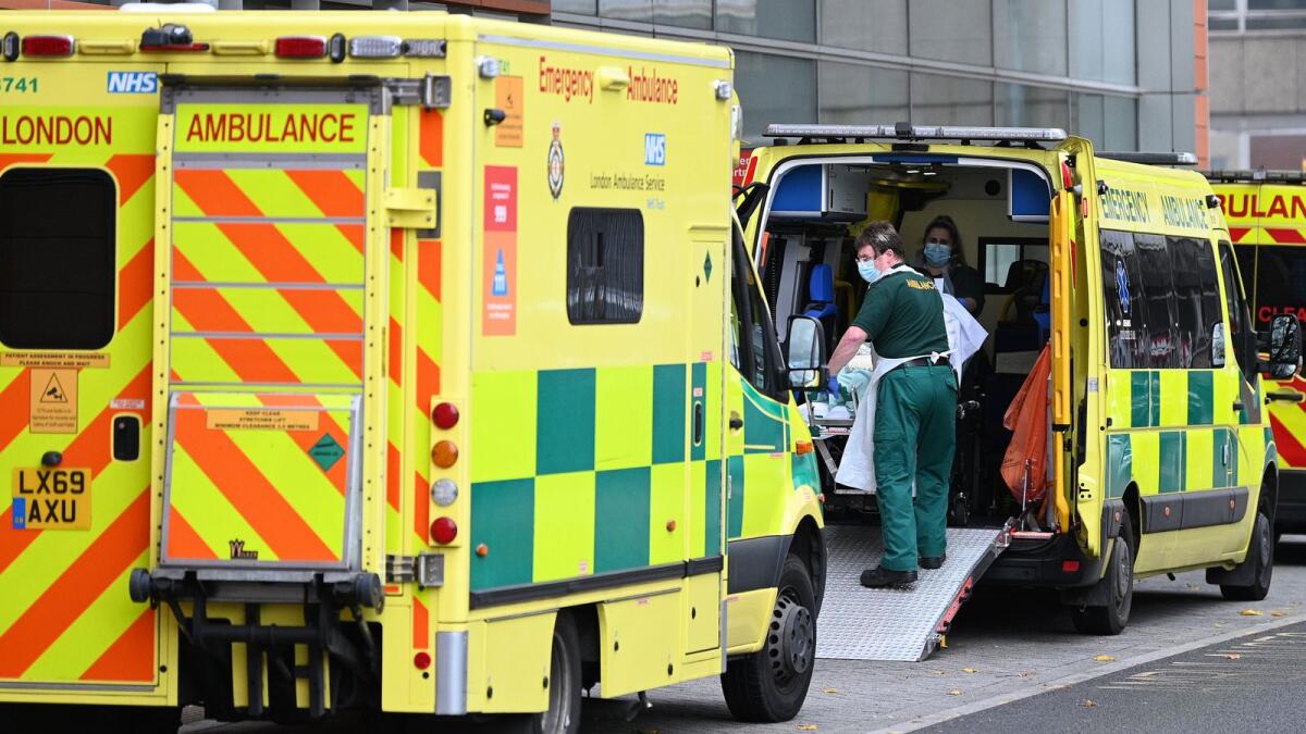 Paramedics move a patient from an ambulance outside the Royal London Hospital in east London on November 12, 2021. (Photo: AFP)