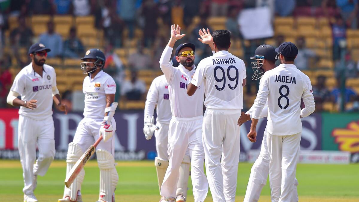 India's R Ashwin celebrates with teammates after dismissing Sri Lanka's Kusal Mendis during the third day of the second Test at the M Chinnaswamy Stadium in Bengaluru on Monday. — PTI