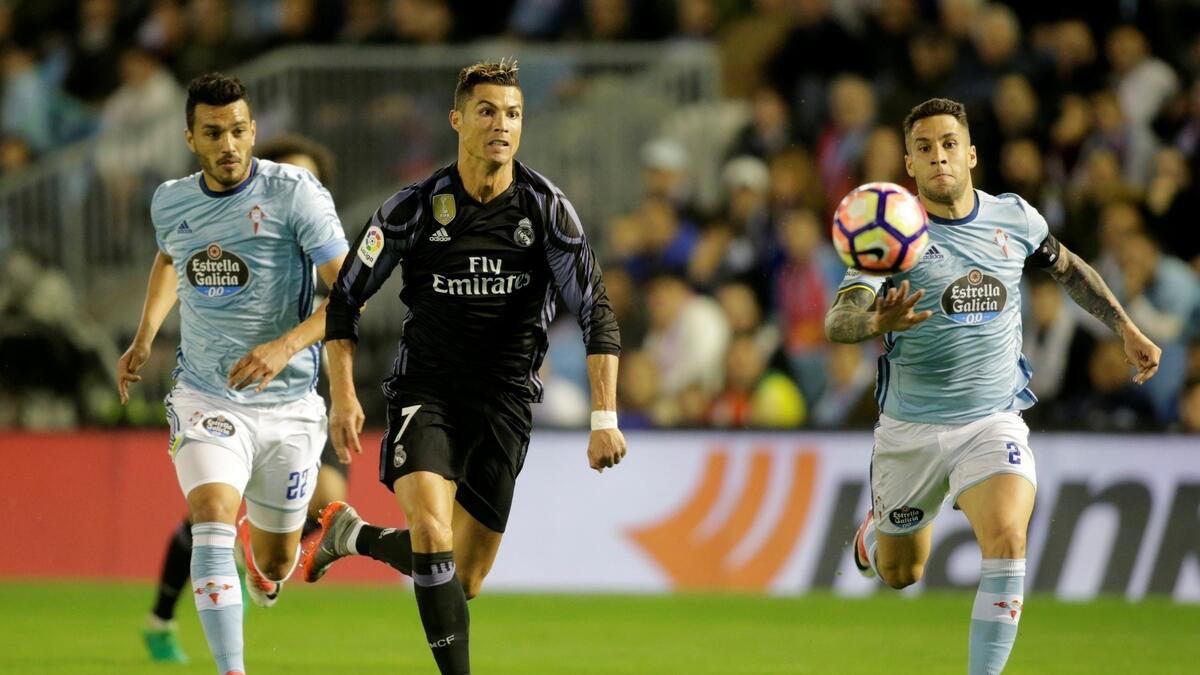 Real on verge of title after Ronaldo inspires win at Celta