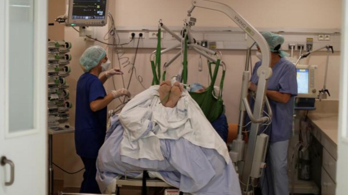 Medical workers treat a patient in the ICU at the Clinique Bouchard-ELSAN private hospital in Marseille, France.