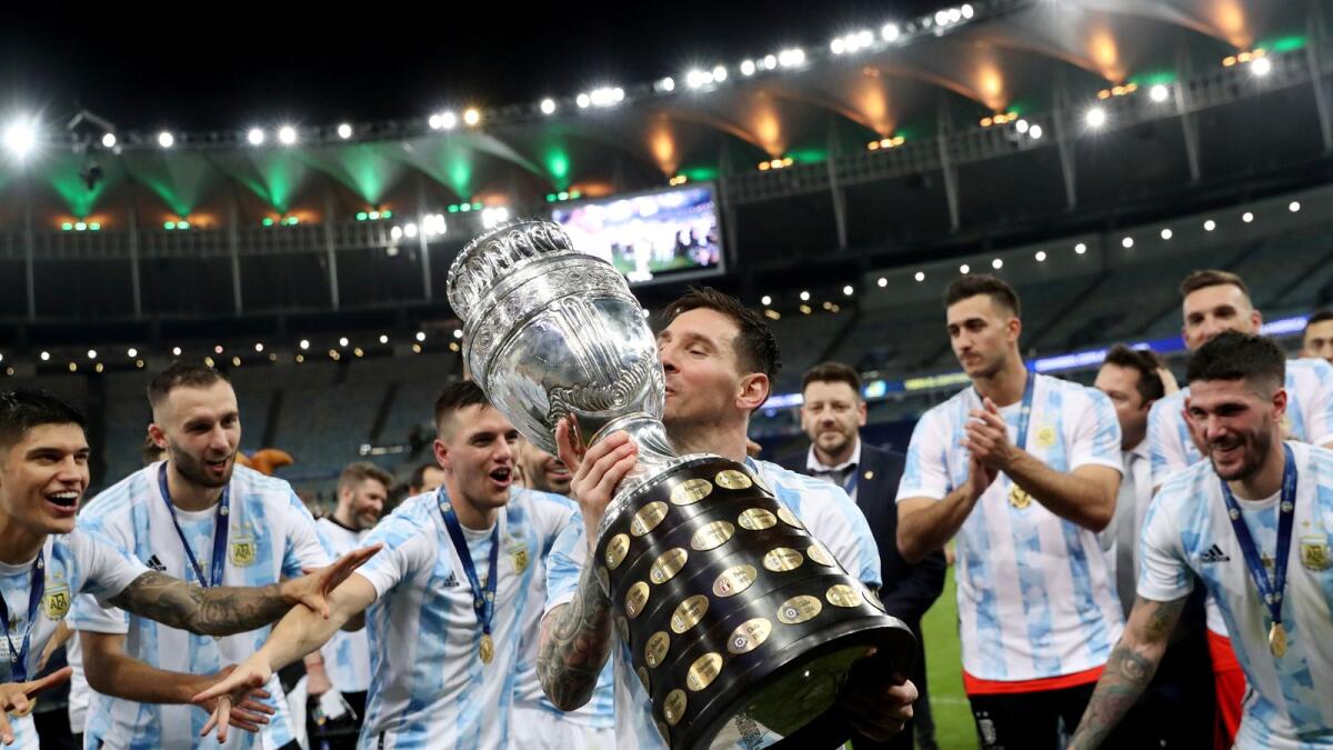 Argentina's Lionel Messi and teammates celebrate winning the Copa America with the trophy.— Reuters