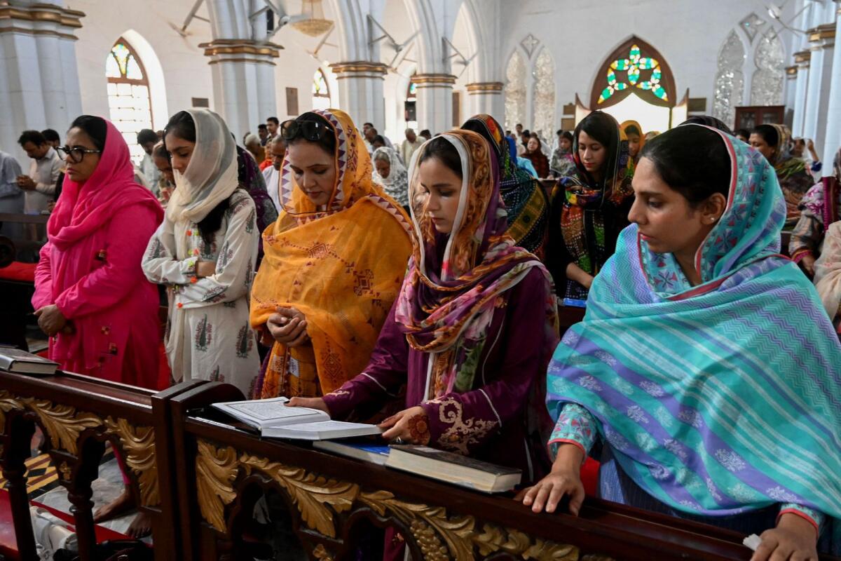 Christians take part in a Sunday prayer at the St. John's Cathedral Church in Peshawar after mob attacked several Pakistani churches over blasphemy allegations. — AFP