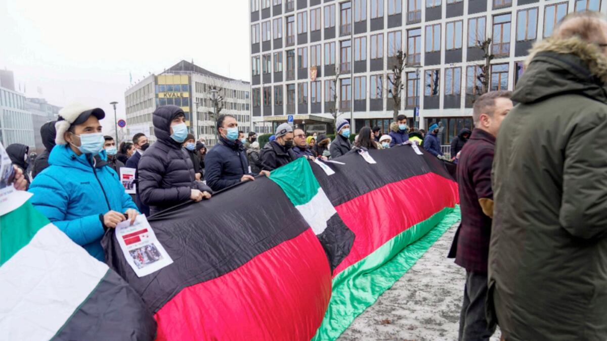 People protest outside the Ministry of Foreign Affairs to demonstrate against the Taliban being in Norway, in Oslo. — AP