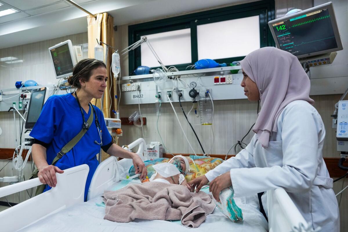 Paediatrician Tanya Haj-Hassan examines wounded children at Al Aqsa Martyrs Hospital in Deir Al Balah, central Gaza on March 16, 2024. — AP