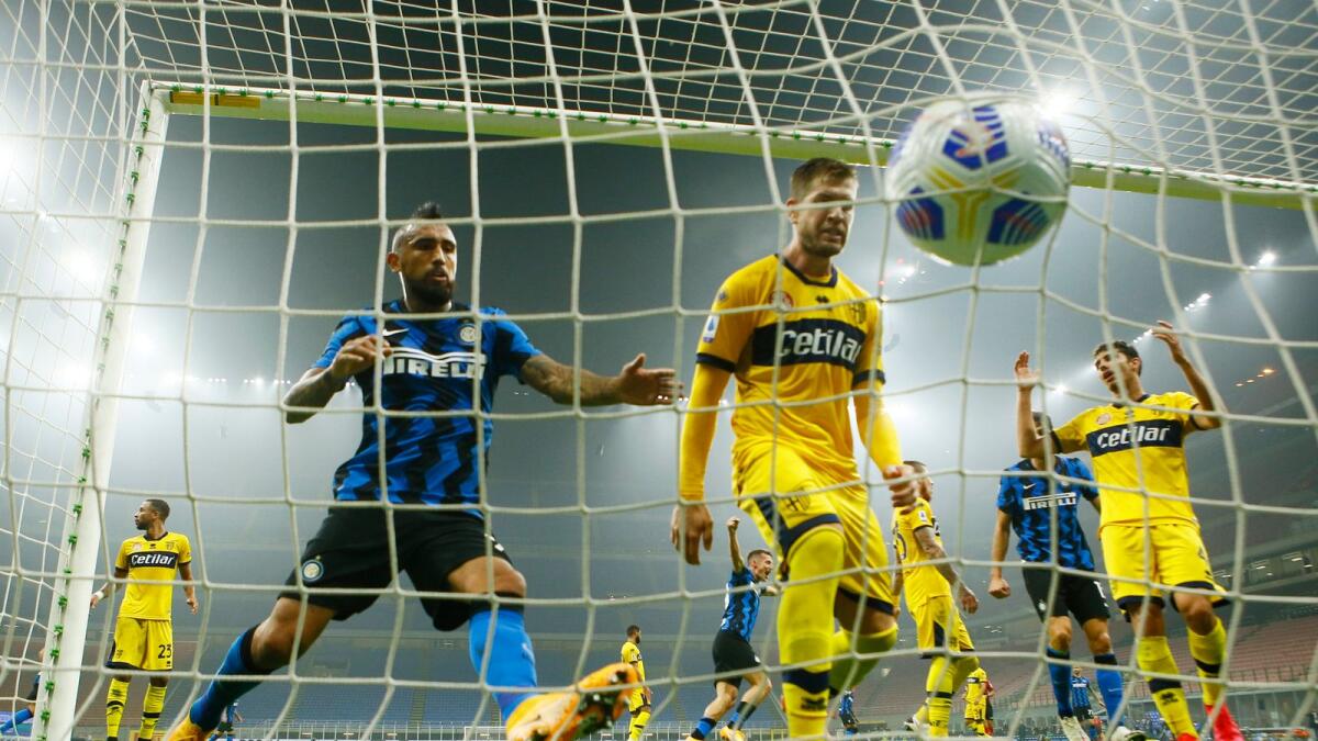 Inter's Arturo Vidal and Parma's Riccardo Gagliolo during the Serie A match. — Reuters