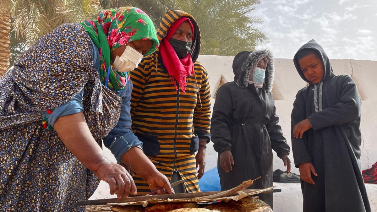 Libyan women bake flatbread near the Libyan town of Ghadames, a desert oasis some 650 kilometres (400 miles) southwest of the capital Tripoli on February 3. — AFP