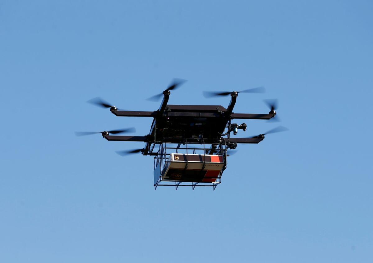 FILE: A drone demonstrates delivery capabilities. Photo: Reuters