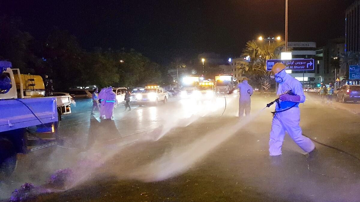 Dubai Municipality workers disinfect streets in Al Rigga Dubai in the early hours of March 22, as part of UAE's nation-wide sanitisation drive to curb the spread of coronavirus. . (Photo by Shihab/ Khaleej Times)