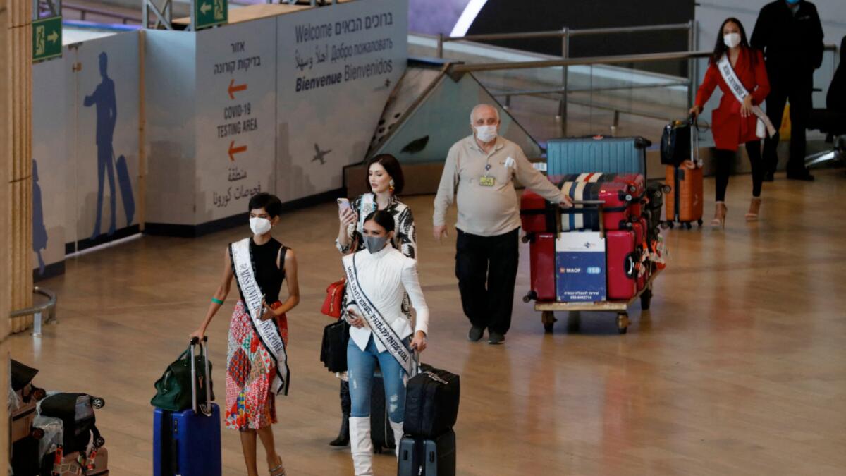 Miss Universe contestants arrive at Israel's Ben Gurion Airport. – AFP