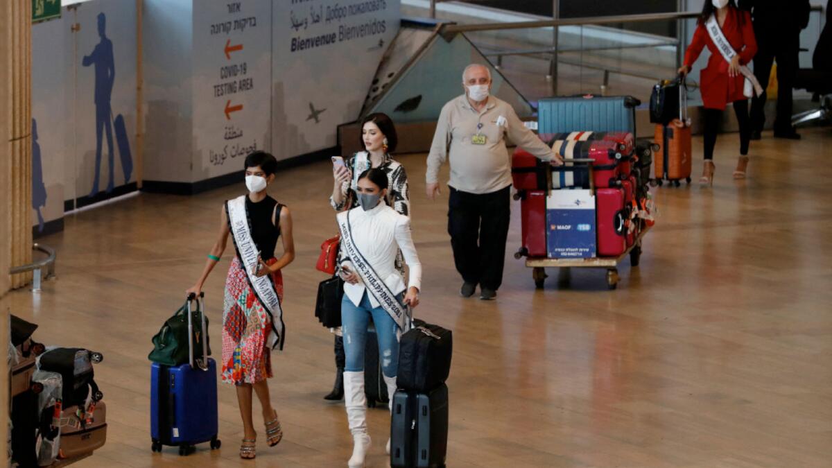 Miss Universe contestants arrive at Israel's Ben Gurion Airport. – AFP