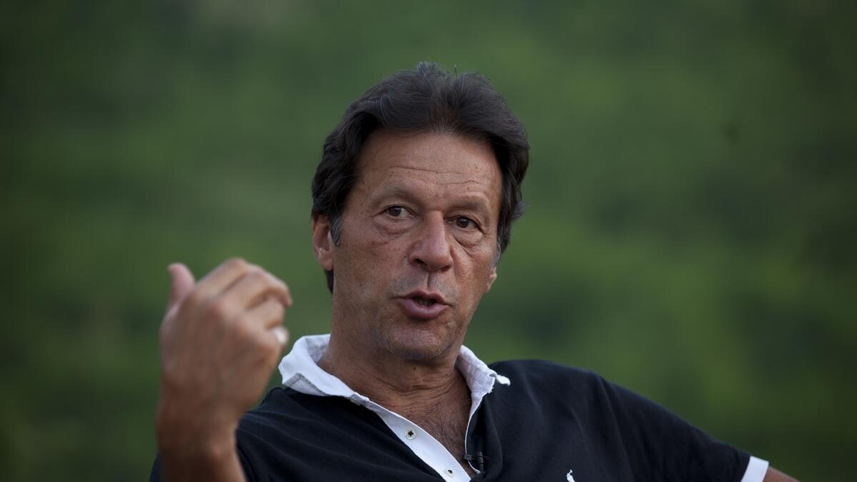 Imran Khan speaks to the press.-AP 