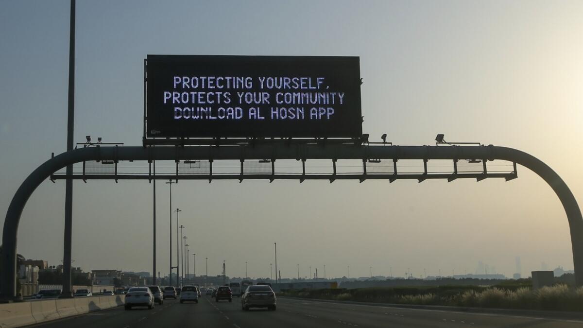 Abu Dhabi, residents, urged, LED screens, protect, community, download, Al Hosn, contact-tracing, testing, app