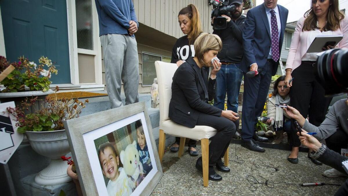 Tima Kurdi, sister of Syrian refugee Abdullah Kurdi whose sons Aylan and Galip and wife Rehan were among 12 people who drowned in Turkey trying to reach Greece, cries while speaking to the media outside her home in Coquitlam, British Columbia.