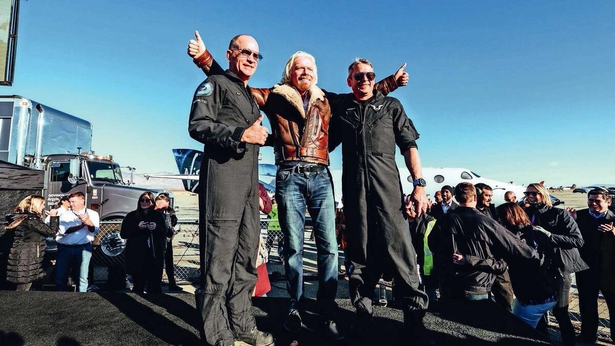 Virgin chief Richard Branson with Mark Stucky and his co-pilot after their spaceship’s successful flight to the edge of space.