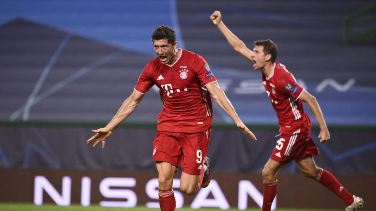 Bayern's Robert Lewandowski celebrates after scoring his side's third goal during the Champions League semifinal against Lyon. - AP