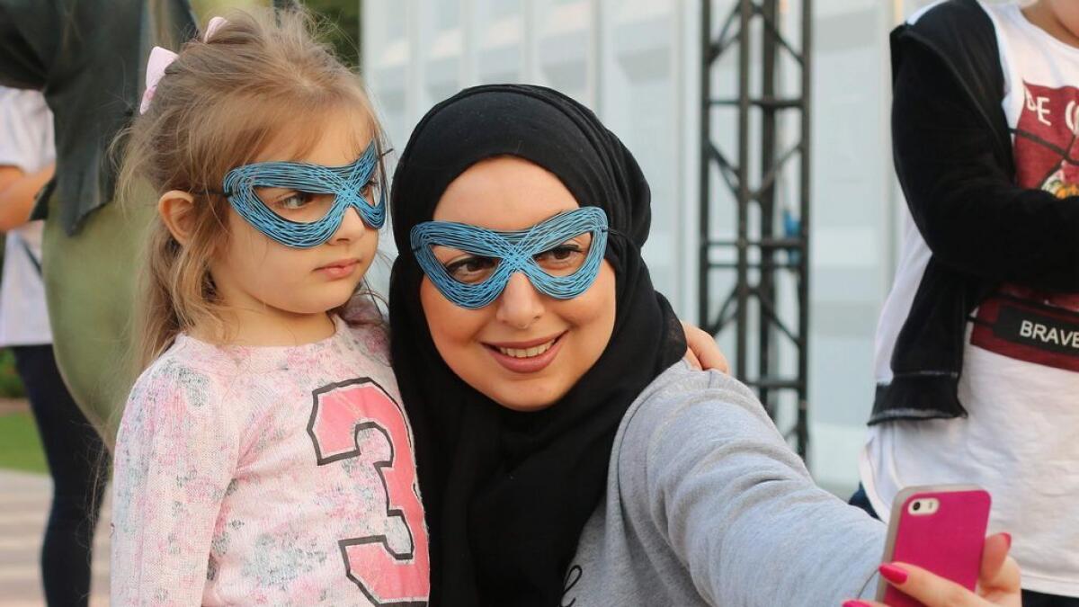 People take their pictures at the Superheroes Festival in Sharjah – Photo by M.Sajjad/Khaleej Times