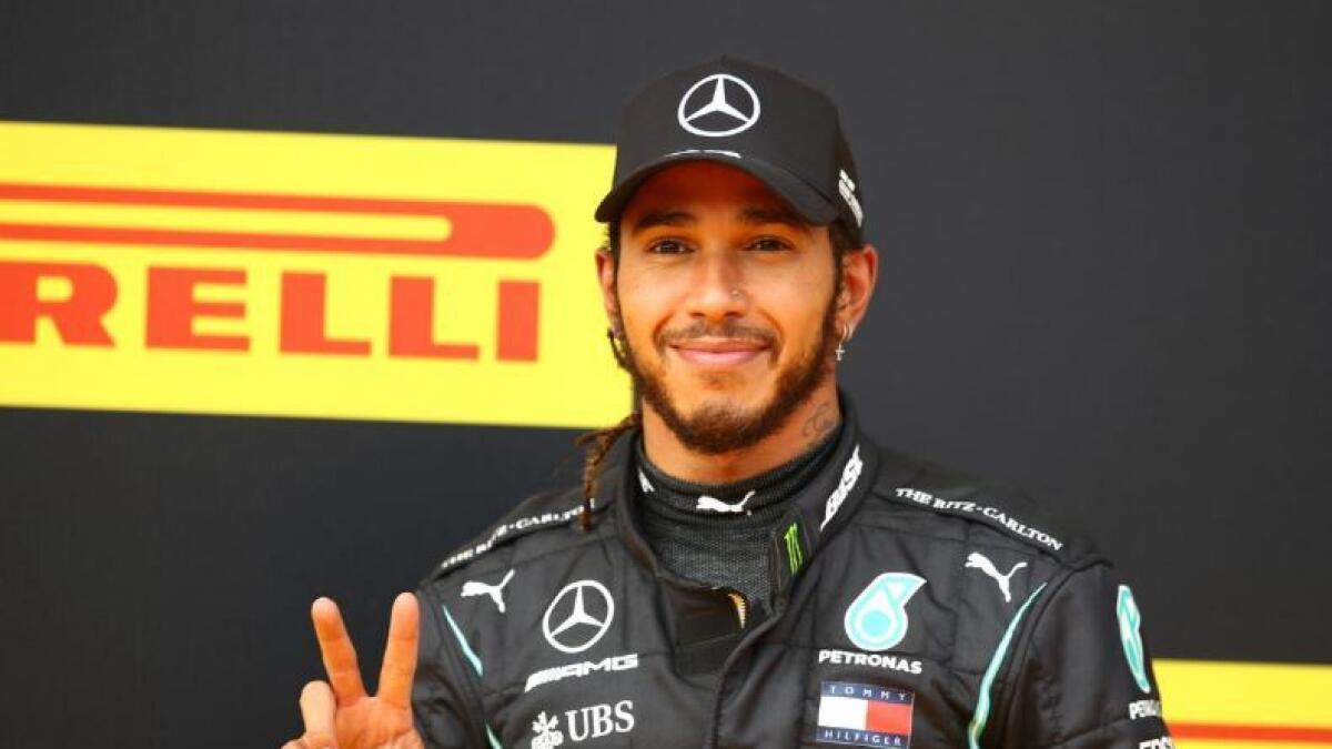 Mercedes' Lewis Hamilton celebrates winning the race. (Reuters)