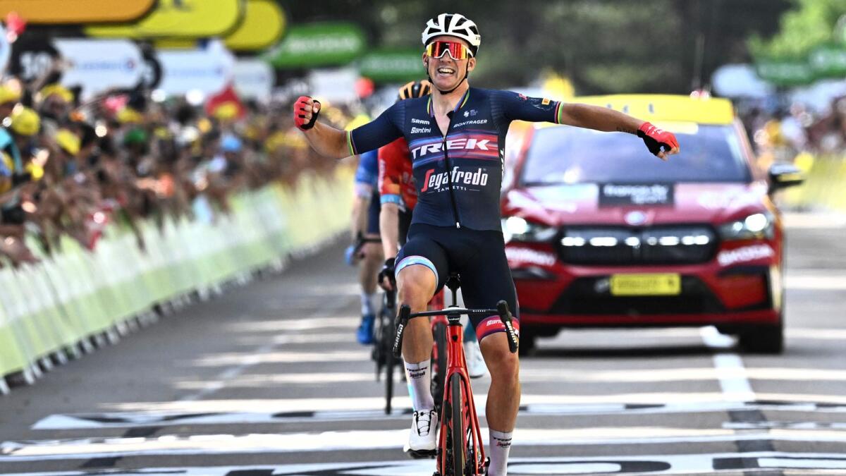 Trek-Segafredo team's Danish rider Mads Pedersen celebrates after winning the 13th stage of the Tour de France on Friday. — AFP