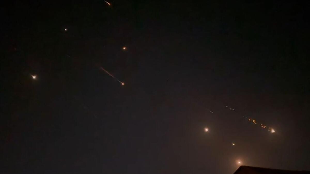 A video grab from AFPTV shows explosions lighting up the sky in Hebron during the attack. Photo: AFP