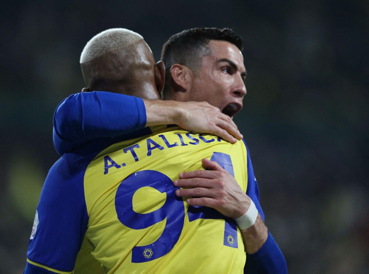 Al Nassr's Anderson Talisca celebrates his goal with Cristiano Ronaldo. —  Reuters