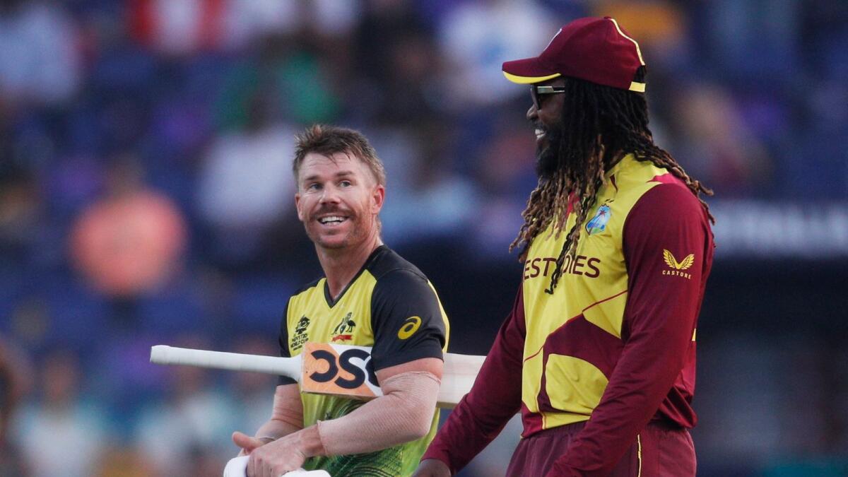West Indies' Chris Gayle shares a light moment with Australia's David Warner after their match in the T20 World Cup. (Reuters)