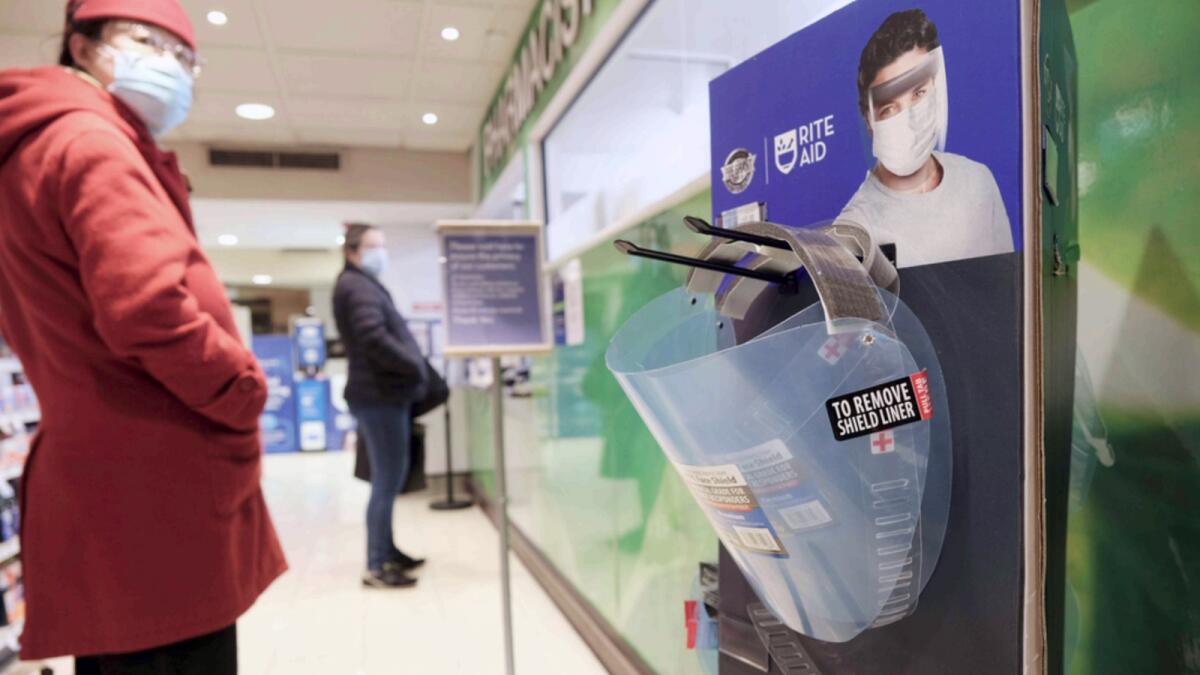 Face shields used to prevent the transmission of Covid-19 sit for sale in a pharmacy in Grand Central Terminal in New York. — AFP